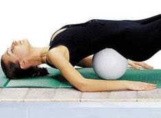 Exercise with a roller under the lower back